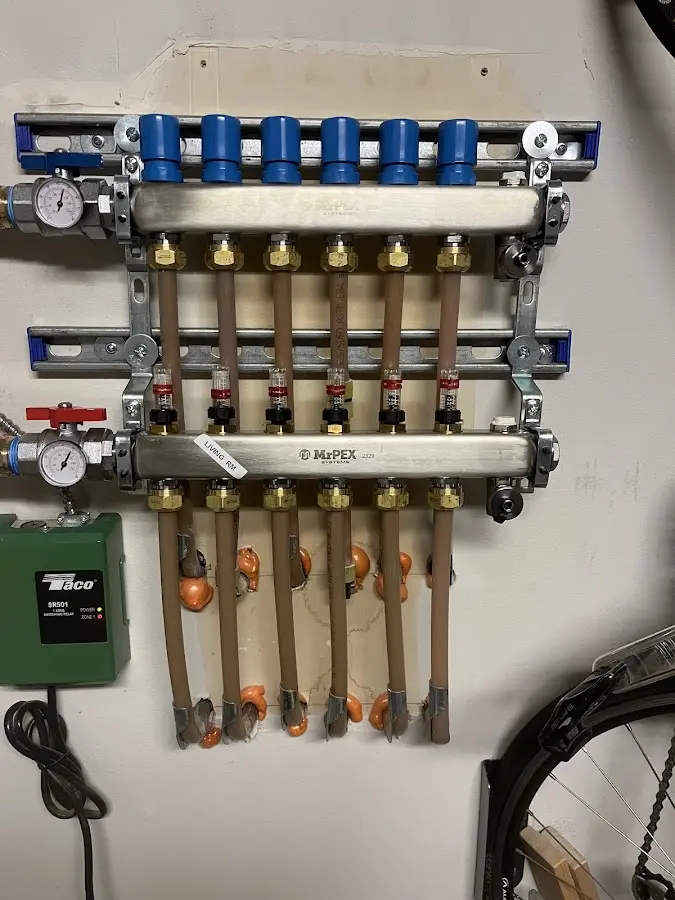 Plumber performing Water Heater Repair at a residential property in Cecil