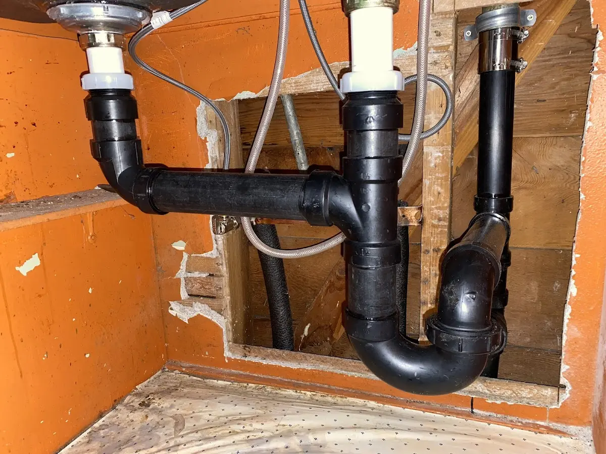Professional Garbage Disposal Repair equipment and tools on the job in Cecil